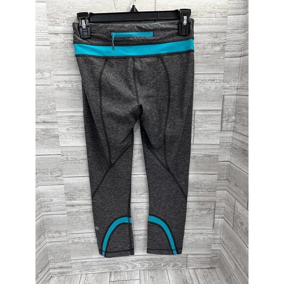 Lululemon Gray Aqua Trim Crop Leggings Size 4 Hidden Zip Pocket Logo Back - Picture 3 of 4